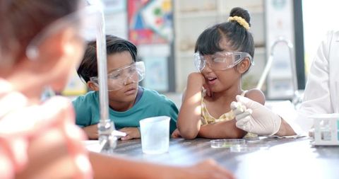 Curious Kids Engaging in Classroom Chemistry Experiment
