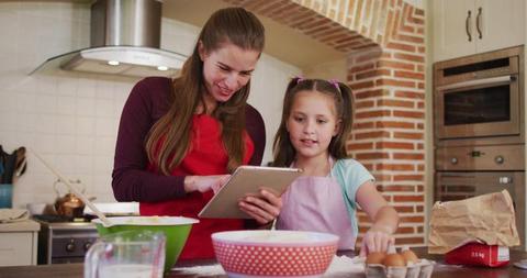 Mother and Daughter Cooking Together in Kitchen Using Tablet - Download Free Stock Images Pikwizard.com