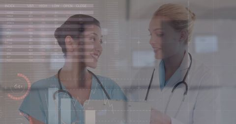 Caucasian Female Doctors Analyzing Medical Data Files