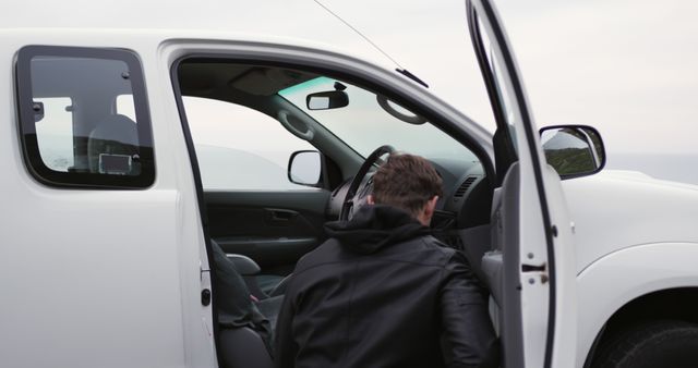 Man Checking Interior of White Pickup Truck - Download Free Stock Images Pikwizard.com