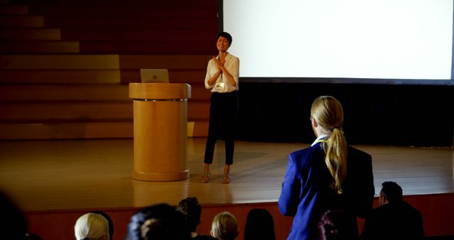 Confident Businesswoman Speaking at Corporate Presentation - Download Free Stock Images Pikwizard.com