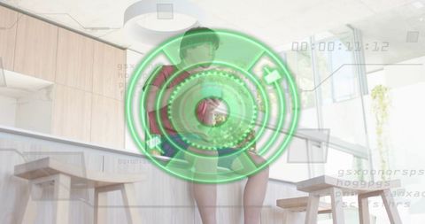 Young Asian Man Perched on Kitchen Counter with Futuristic HUD Overlay Showing Timecode