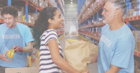 Volunteer Helping Donor in Organized Warehouse - Download Free Stock Images Pikwizard.com