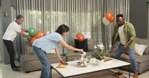 Friends Decorating Together for Home Celebration