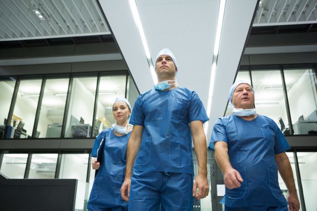 Team of surgeons walking in hospital