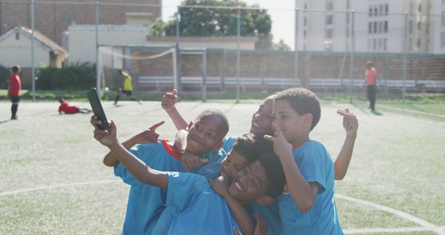 Young Soccer Players Taking Selfie on Field After Match - Download Free Stock Images Pikwizard.com