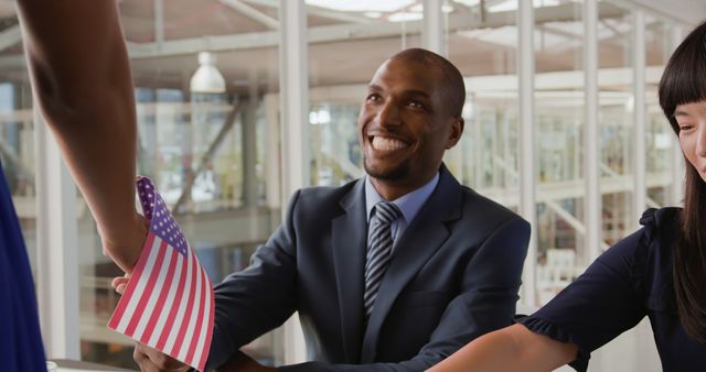 Man Holding American Flag During Business Meeting - Download Free Stock Images Pikwizard.com
