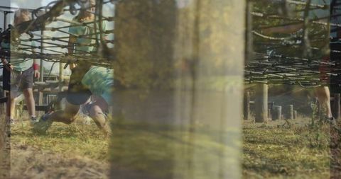 Children enjoying team building exercise on rope course