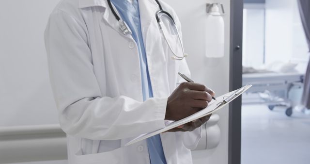 Healthcare Professional Taking Notes in Hospital Ward - Download Free Stock Images Pikwizard.com