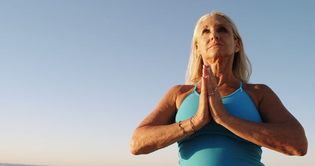 Senior Woman Practicing Yoga Outdoors at Sunset - Download Free Stock Images Pikwizard.com