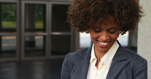 Confident businesswoman smiling outdoors in professional attire - Download Free Stock Images Pikwizard.com