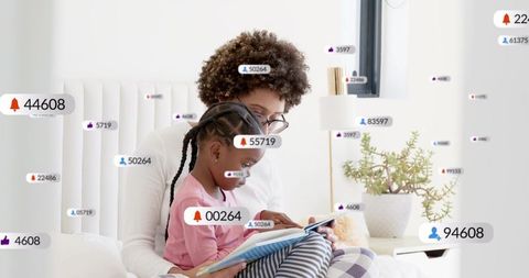Caregiver and child reading together on bed with floating social media notification icons
