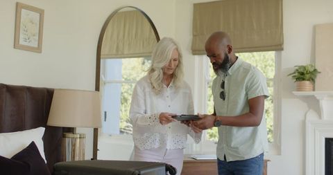 Couple Preparing Together in Cozy Bedroom Before Wedding Ceremony