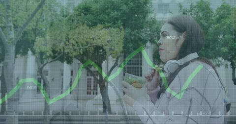 Young Woman Uses Smartphone Amidst Growing Data Processing Trend