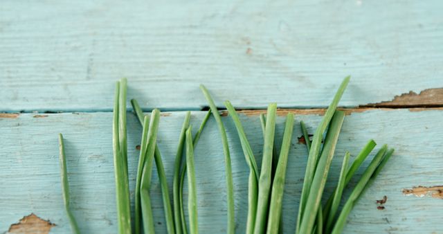 Fresh Green Chives on Rustic Blue Wooden Background - Download Free Stock Images Pikwizard.com