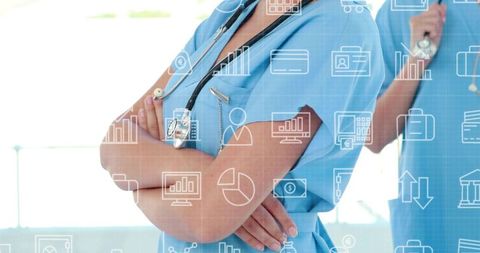 Standing Female Nurses Crossing Arms with Digital Data Icons Showing Healthcare Analytics