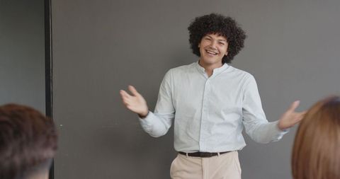 Confident man leading presentation in modern office setting