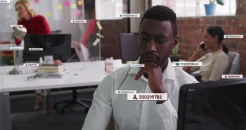 Focused professional typing in modern office environment