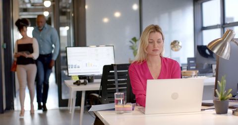 Focused Businesswoman Working at Laptop in Modern Office - Download Free Stock Images Pikwizard.com