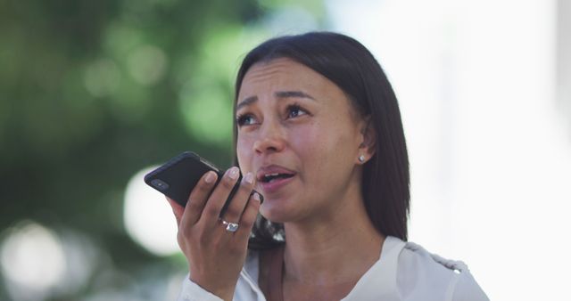 Stressed Woman Speaking on Smartphone in Park - Download Free Stock Images Pikwizard.com