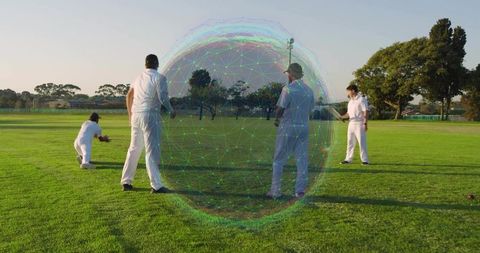 Crouching wicketkeeper saving red ball with holographic orb, team in white kit on cricket field