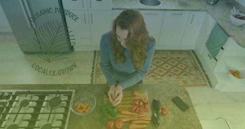 Woman Preparably Chopping Organic Vegetables in Cozy Kitchen