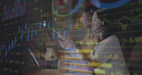 Diverse Businesswoman Analyzing Financial Data on Laptop