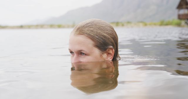 Woman Swimming in Calm Natural Lake - Download Free Stock Photos Pikwizard.com