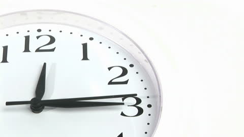 Analog Clock Face with Black Hands Showing Time at Three O'clock