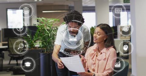Collaborative team using augmented reality hud and digital interface in modern open-plan office