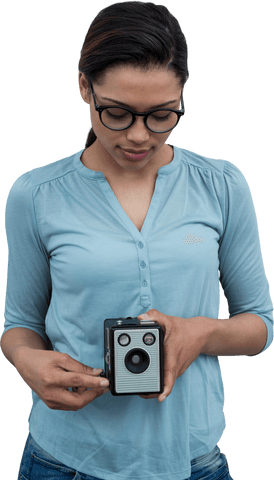 Young Woman Wearing Glasses Holds Transparent Vintage Camera