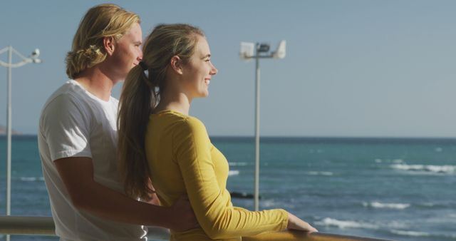 Smiling Couple Admiring Ocean View on Sunny Day - Download Free Stock Images Pikwizard.com