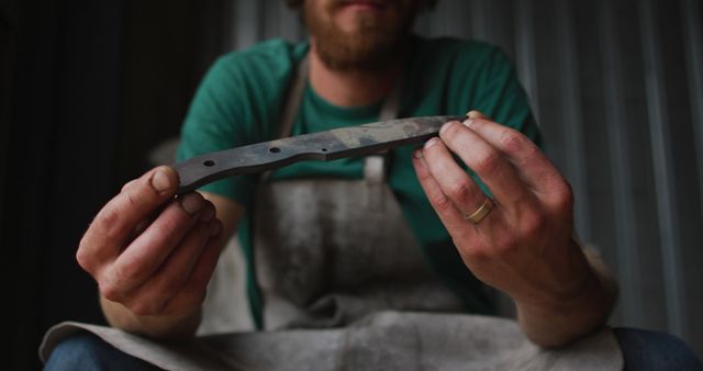 Craftsman Holding Handmade Knife Blade in Workshop - Download Free Stock Images Pikwizard.com