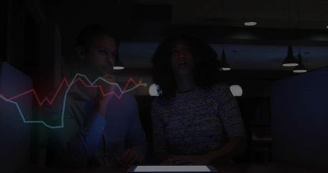 Professionals Analyzing Market Trends with Holographic Display