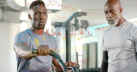 Adult man training on elliptical while coach monitoring performance metrics overlay