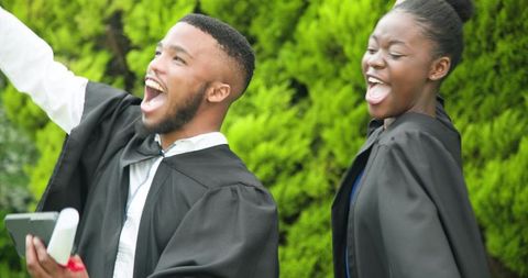 Joyful Graduates Celebrating Success Outdoors