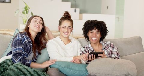 Casual bonding time among friends on sofa