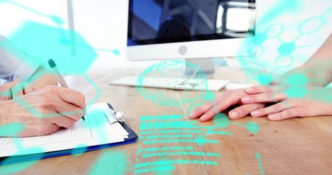 Team collaboration with digital interface in workplace