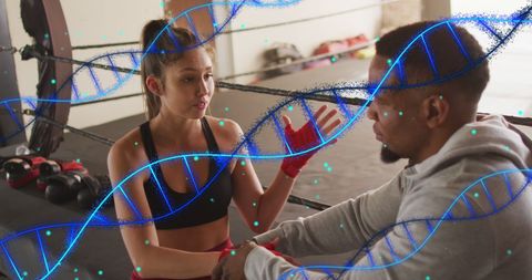 Diverse Athletes Discussing Fitness with DNA Overlay in Boxing Gym