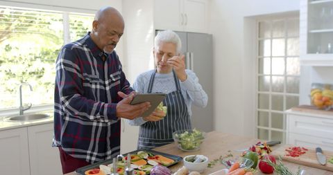 Senior Couple Cooking with Digital Tablet in Modern Kitchen - Download Free Stock Images Pikwizard.com
