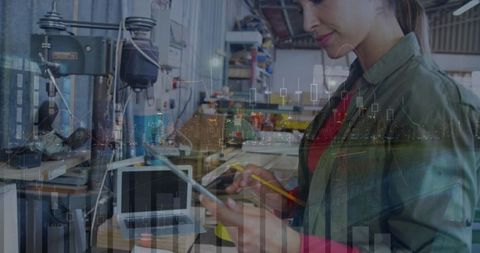 Tech-Savvy Businesswoman Analyzing Data on Tablet in Industrial Workspace - Download Free Stock Images Pikwizard.com