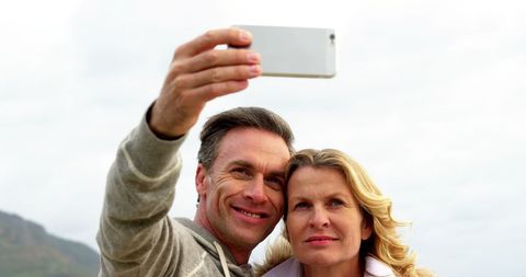 Happy Middle-Aged Couple Taking Selfie Outdoors - Download Free Stock Images Pikwizard.com