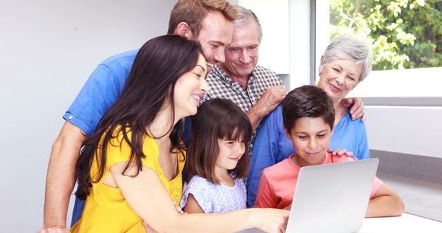 Happy Family of Mixed Generations Using Laptop Together at Home - Download Free Stock Images Pikwizard.com