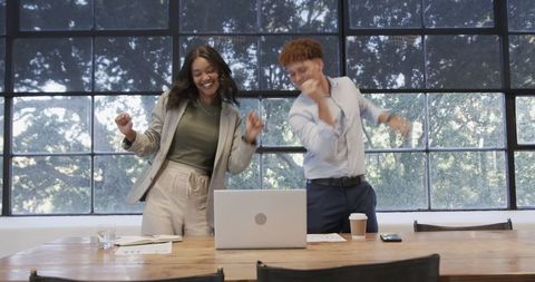 Happy Team Celebrating Achievement in Modern Office