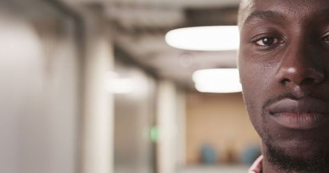 Close-Up Portrait of Professional in Modern Hallway with LED Lights