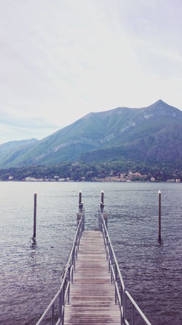 Scenic Pier Extending into Calm Mountain Lake - Download Free Stock Images Pikwizard.com