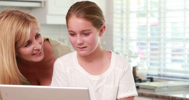 Mother Helping Daughter with Online Learning at Home - Download Free Stock Images Pikwizard.com