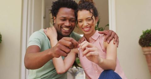 Happy Couple Celebrating New Home Purchase with Keys - Download Free Stock Images Pikwizard.com