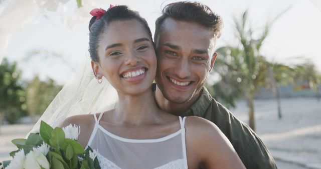 Smiling Bride and Groom Embracing at Beach Wedding Ceremony - Download Free Stock Images Pikwizard.com