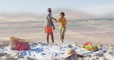 Senior Couple Enjoying Romantic Beach Picnic with Ocean View